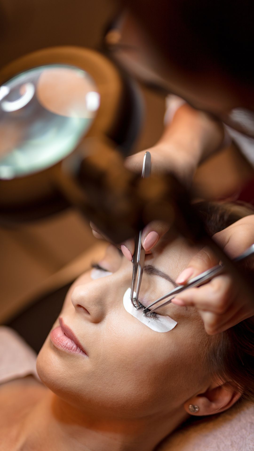 Client undergoing lash lift & tint treatment.