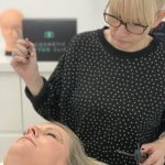 A mature female client undergoing SPMU for Mother's Day.