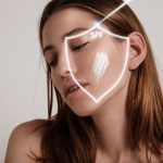 A woman's face with SPF protection for SPMU Longevity.